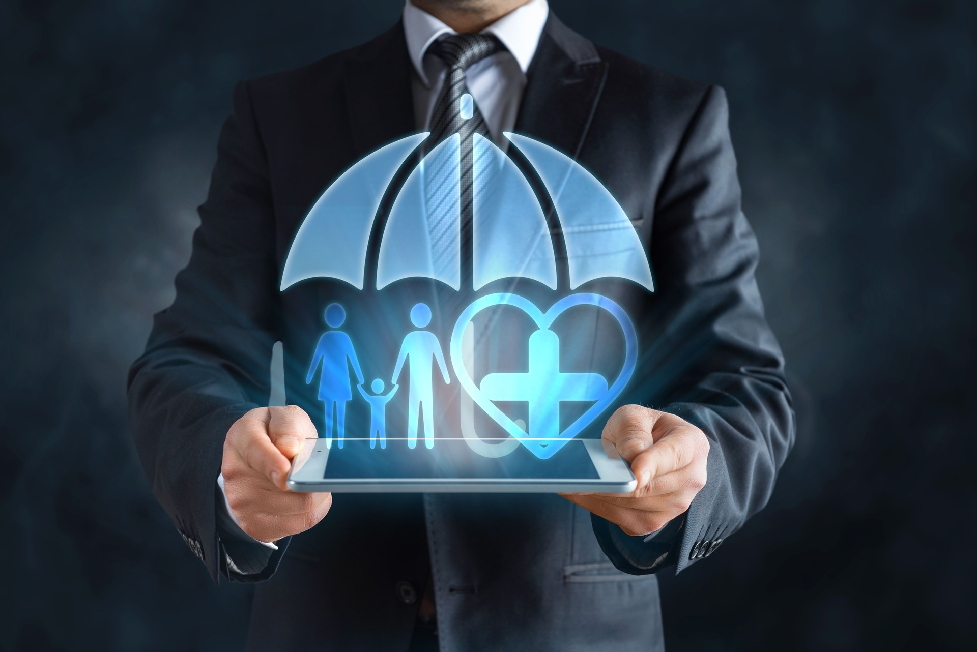 Family and heart shaped hologram under umbrella, insurance concept